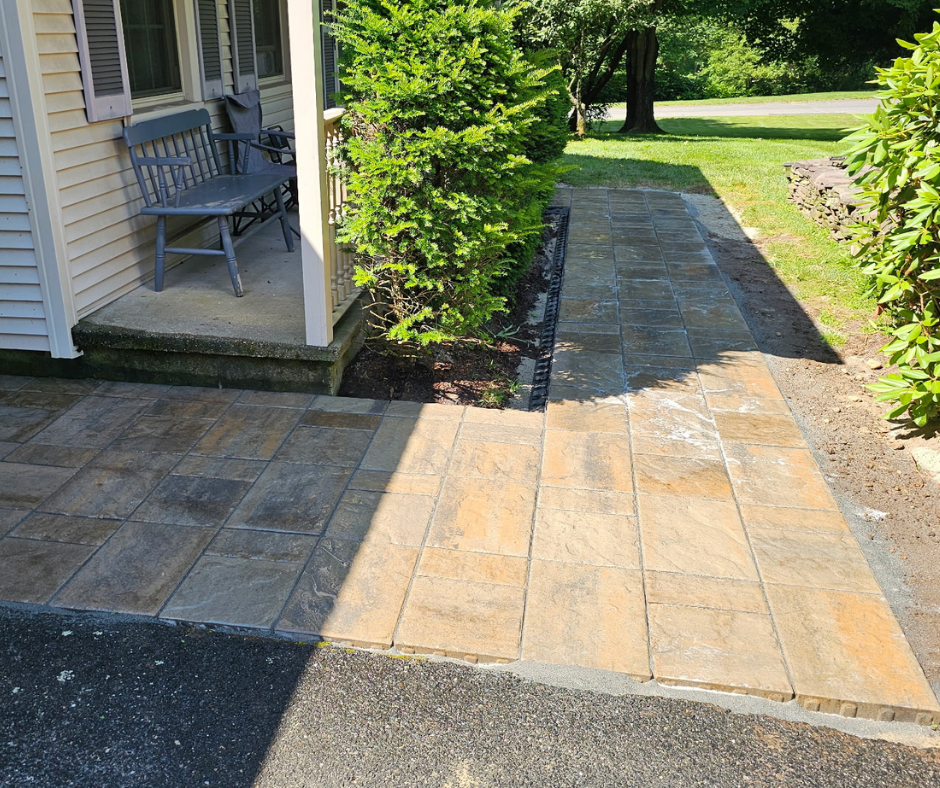 Interlocking paver walkway installed for a residential property located in Hampden, MA. Front yard walkway landscaping by Keith Isham Landscaping in Western Ma.